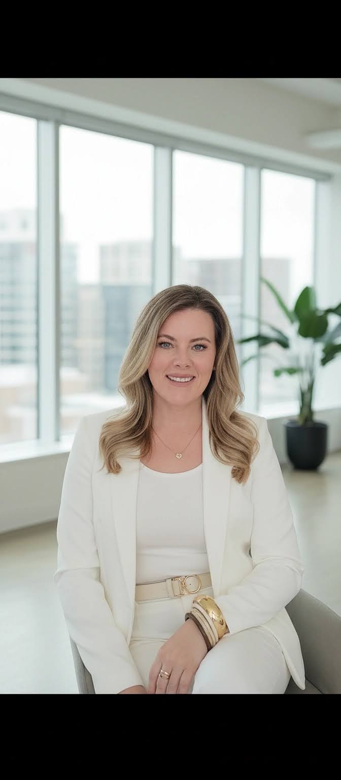 Laura Hartley, Realtor, in a white suit